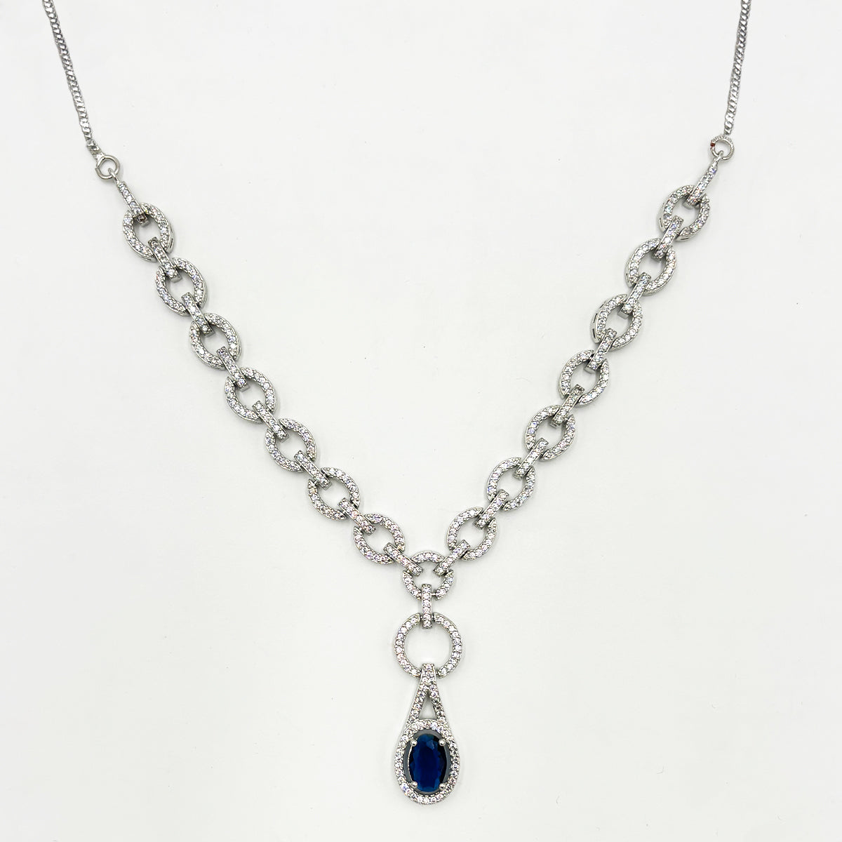 Modern Interlinked Zircon Chain Necklace Set with Deep Blue Sapphire Teardrop Pendant